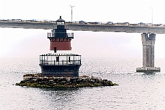 Plum Beach Light Under Newport Bridge in Rhode Island